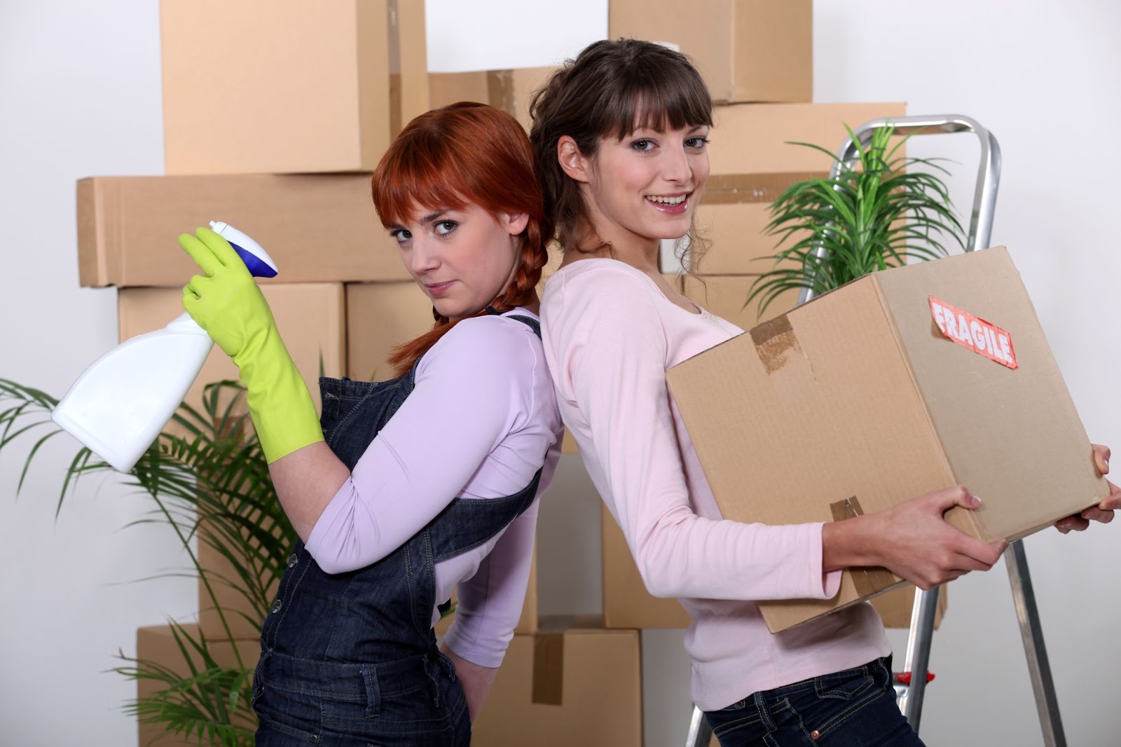 a two girl wearing a water cleaning spray and a girl wearing a box